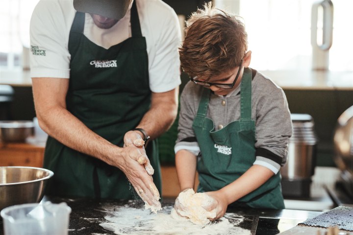 a man cooking food on a table